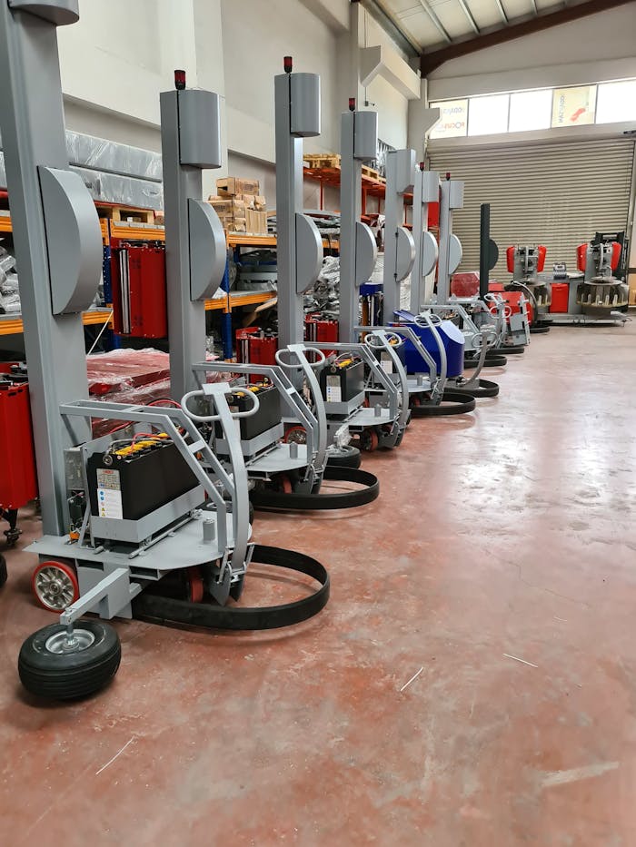 A lineup of advanced industrial machines in a spacious warehouse, Şehitkamil.